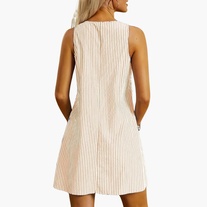 Striped mini dress with round neckline and practical hip-level pockets for everyday occasions