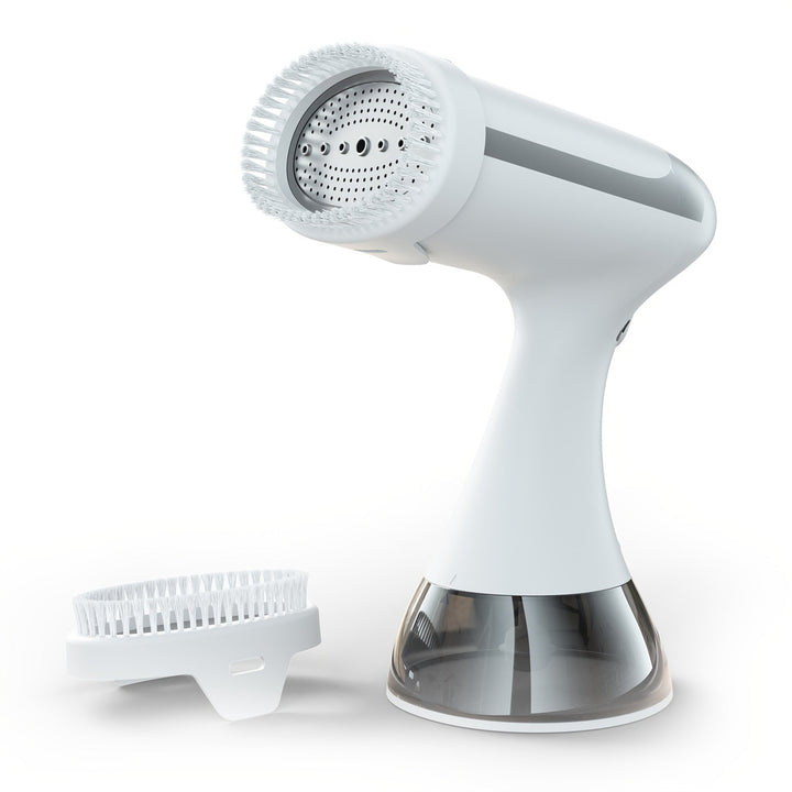 Handheld garment steamer in white with brush attachment