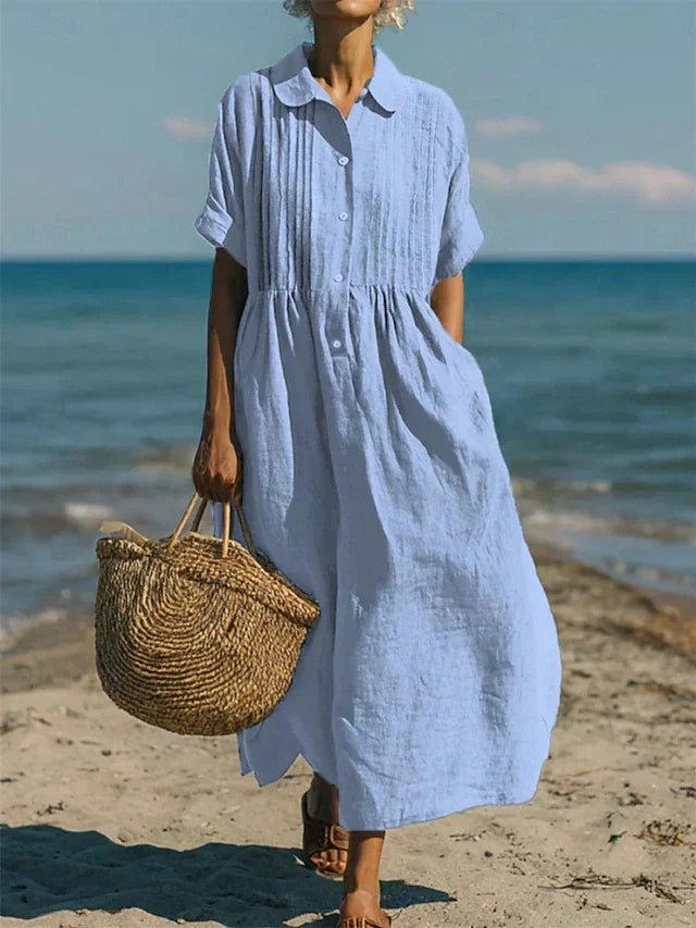 Close-up view of collared button midi dress showing pintuck detailing and relaxed fit