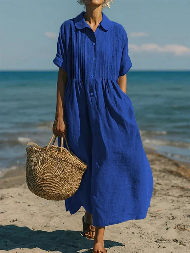 Side view of midi dress with short sleeves and button-through closure in white fabric