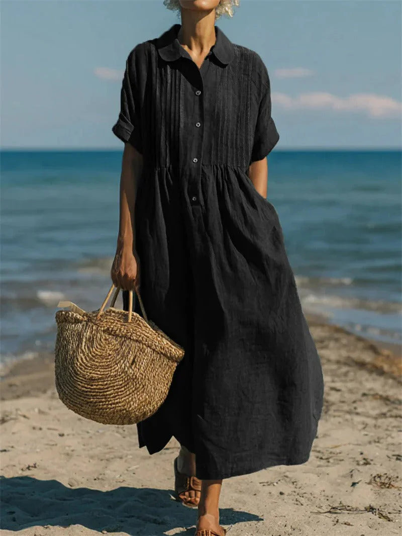 Woman wearing collared button midi dress in casual beach setting with natural styling