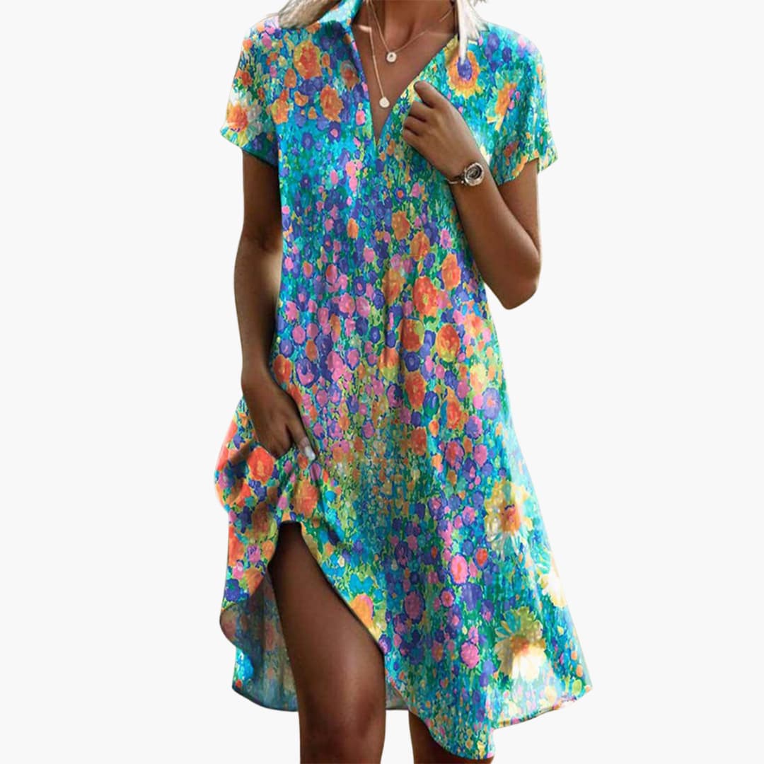 Close-up view of polka dot midi dress showing collared V-neck detail and spotted print pattern
