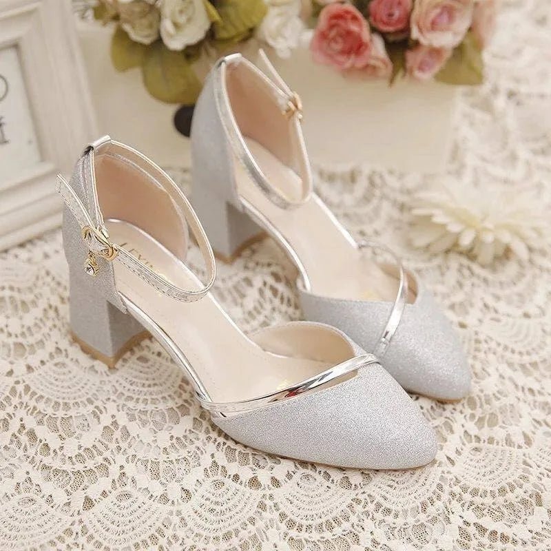 Side view of women's block heel shoes showing adjustable ankle strap and structured heel construction