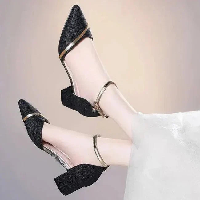 Close-up detail of metallic trim accent and smooth finish upper on women's block heel shoes