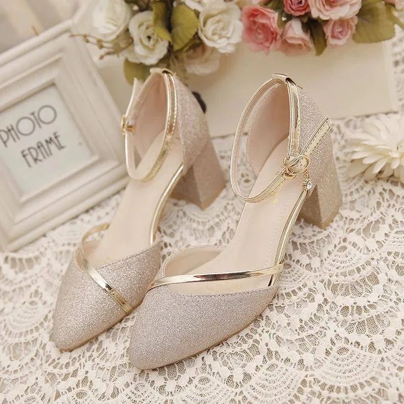 Pair of women's ankle strap block heel shoes displaying cushioned footbed and secure buckle fastening