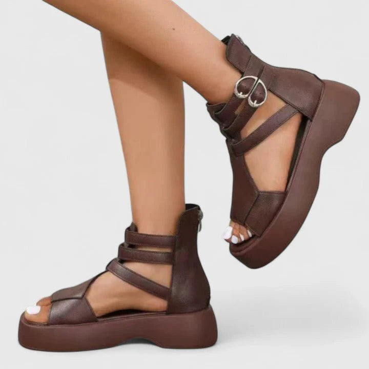 Close-up of double-buckle ankle closure on women's gladiator platform sandals with structured straps