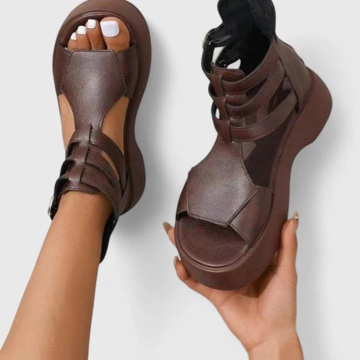 Detail shot of chunky platform sole and crossover strap design on women's gladiator sandals