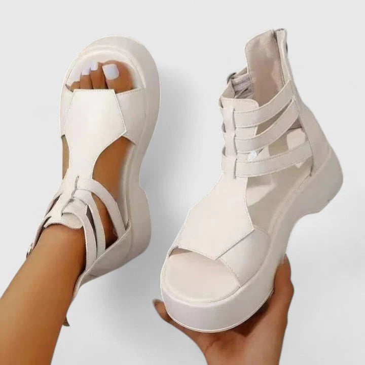 Women's gladiator platform sandals in brown showing full silhouette with ankle buckles and open toe