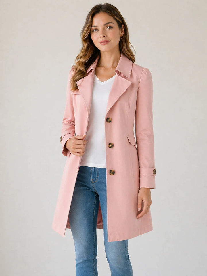 Detail of notched collar and flap pockets on tailored trench coat