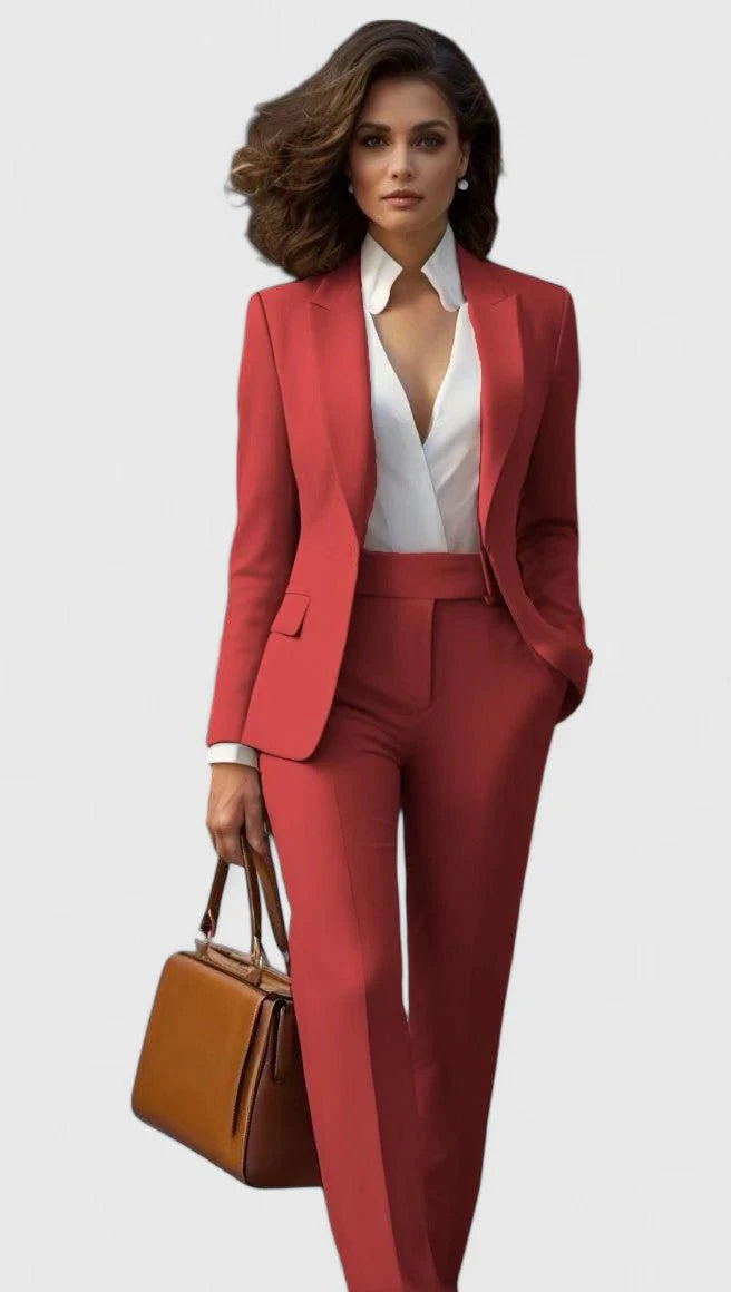 Women's tailored suit set with structured blazer and matching straight-leg trousers in coral shade