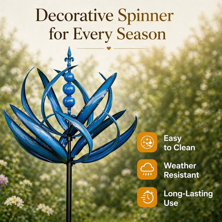 Blue metal garden wind spinner positioned amongst flowering plants in outdoor garden setting