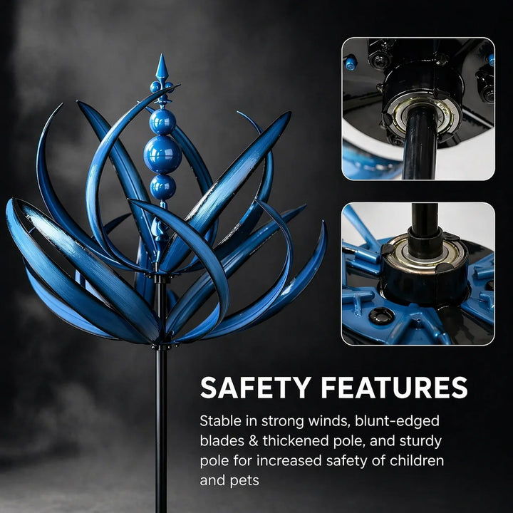 Metal garden wind spinner showing fleur-de-lis finial and curved petal blade construction detail