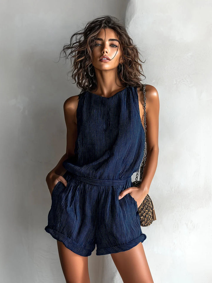 Side view of woman in ribbed romper displaying relaxed silhouette and side pocket detail