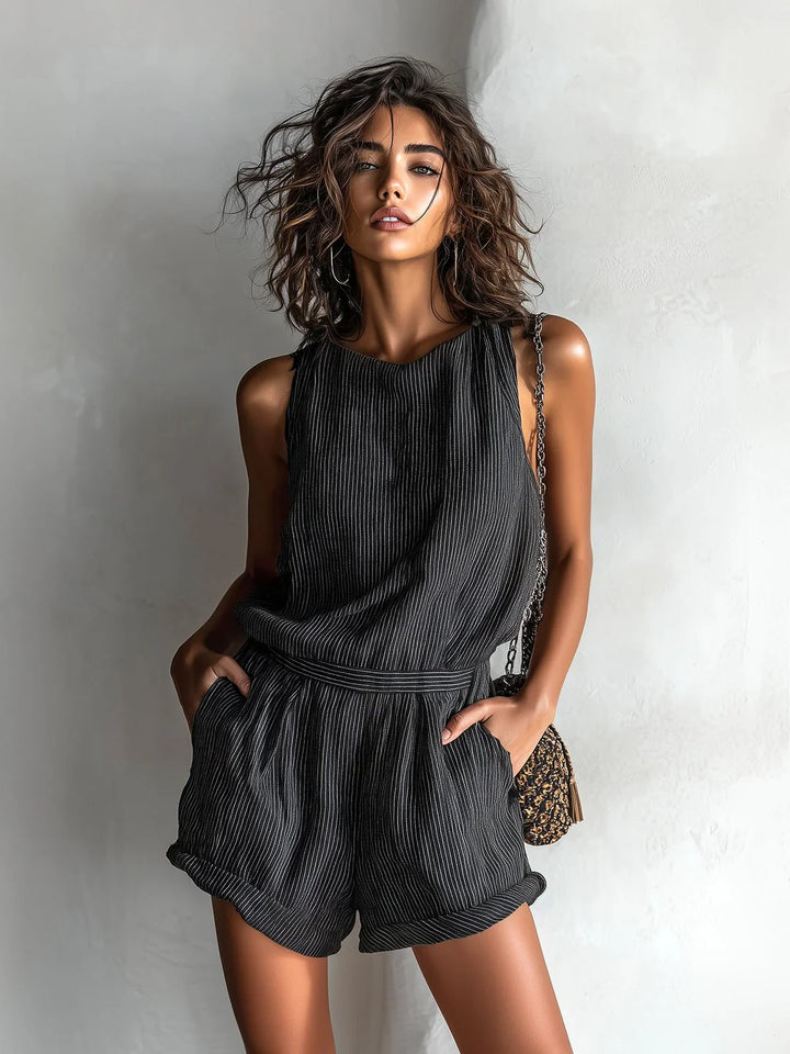 Detail shot of elasticated waistband on ribbed sleeveless romper providing comfortable adjustable fit