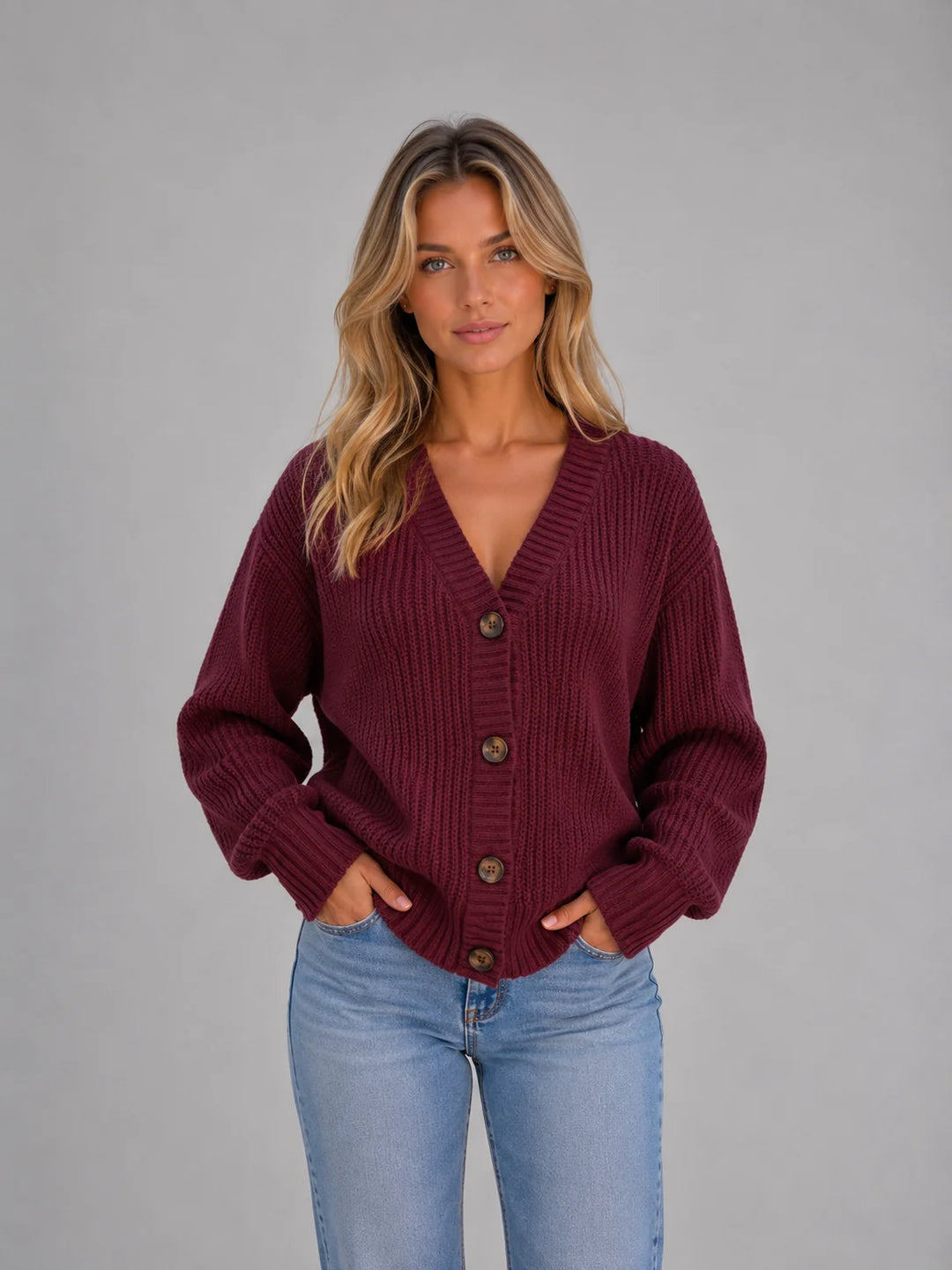 Lifestyle image of chunky knit cardigan with V-neckline styled for everyday casual wear