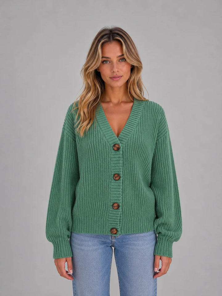 Full-length view of women's chunky knit cardigan with V-neck and relaxed silhouette for autumn wear