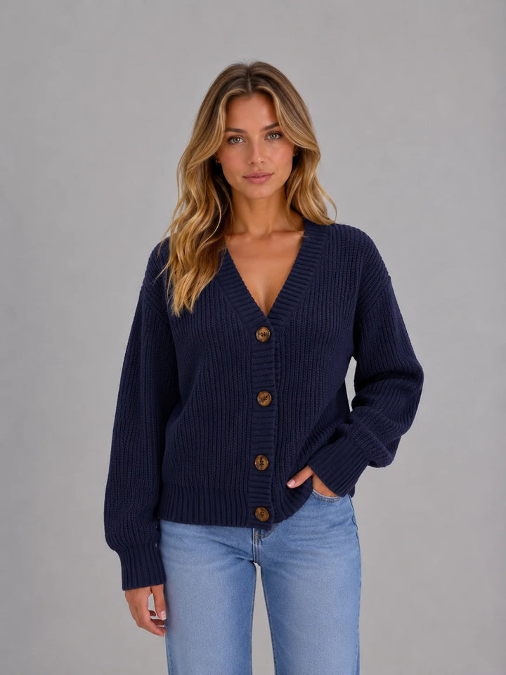 Women's soft ribbed jumper cardigan in purple showing button-front closure and comfortable fit