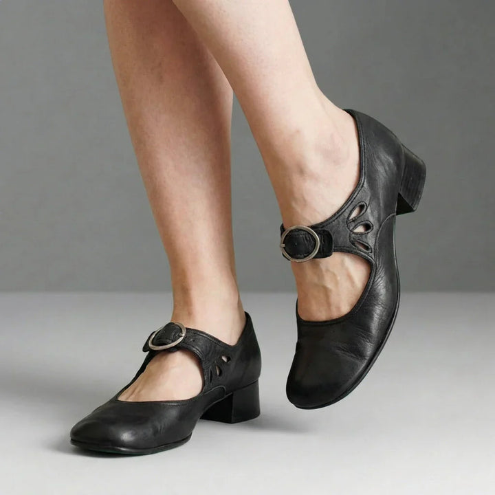 Women's Mary Jane shoes paired with floral midi skirt for casual daytime look
