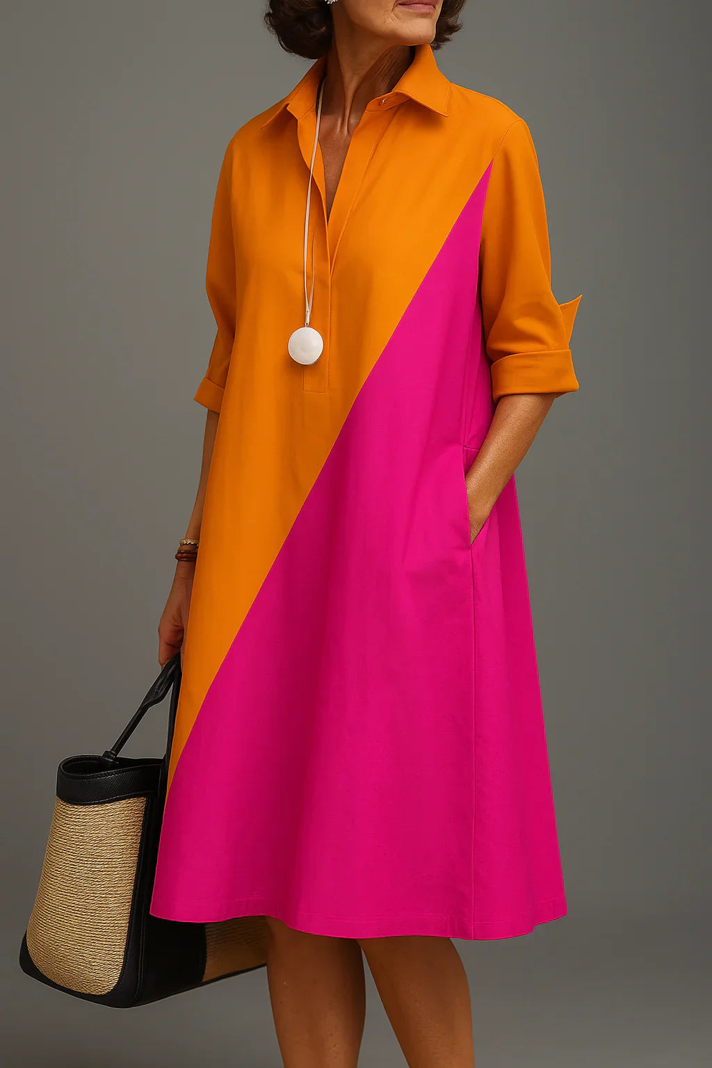 Women's Midi Dress with Elegant Flow and Refined Comfort featuring diagonal orange and fuchsia colour-block design with collared neckline and side pockets