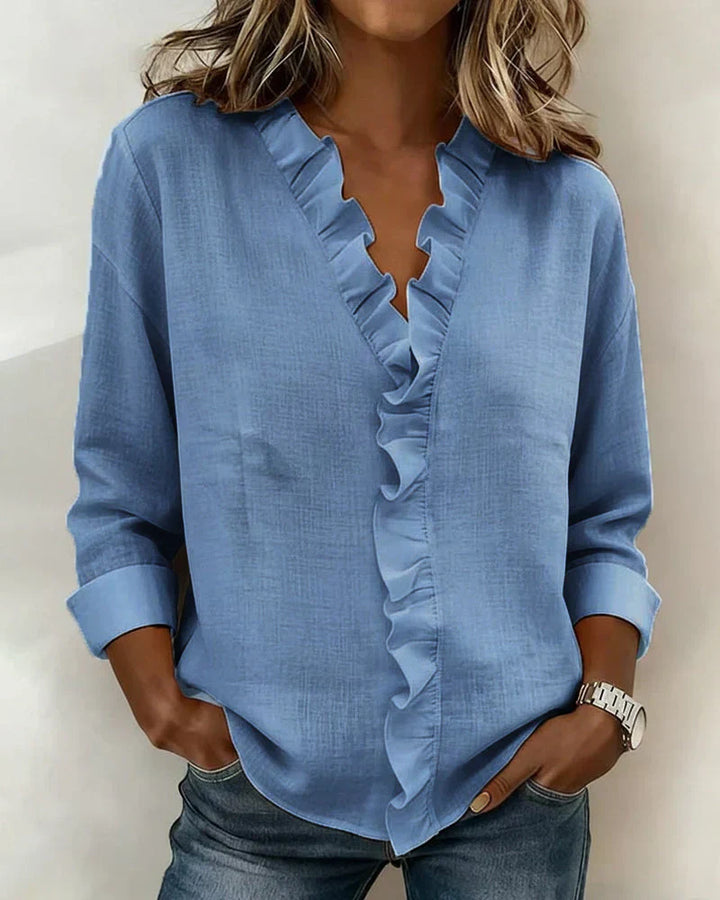 Women's ruffle neck blouse in white with long sleeves and smooth fabric finish