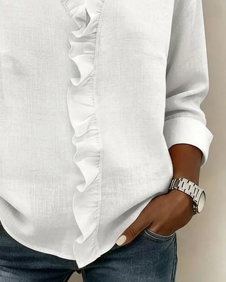 Front view of women's ruffle neck blouse in black showing V-neckline and ruffle detail