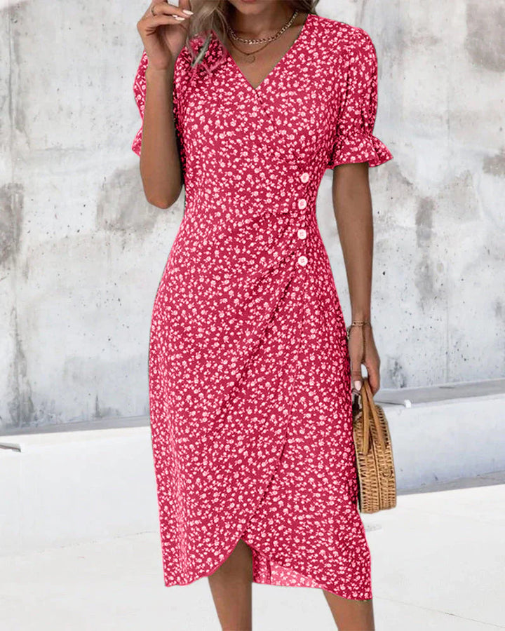 Green floral midi dress with adjustable wrap closure and V-neckline for versatile styling