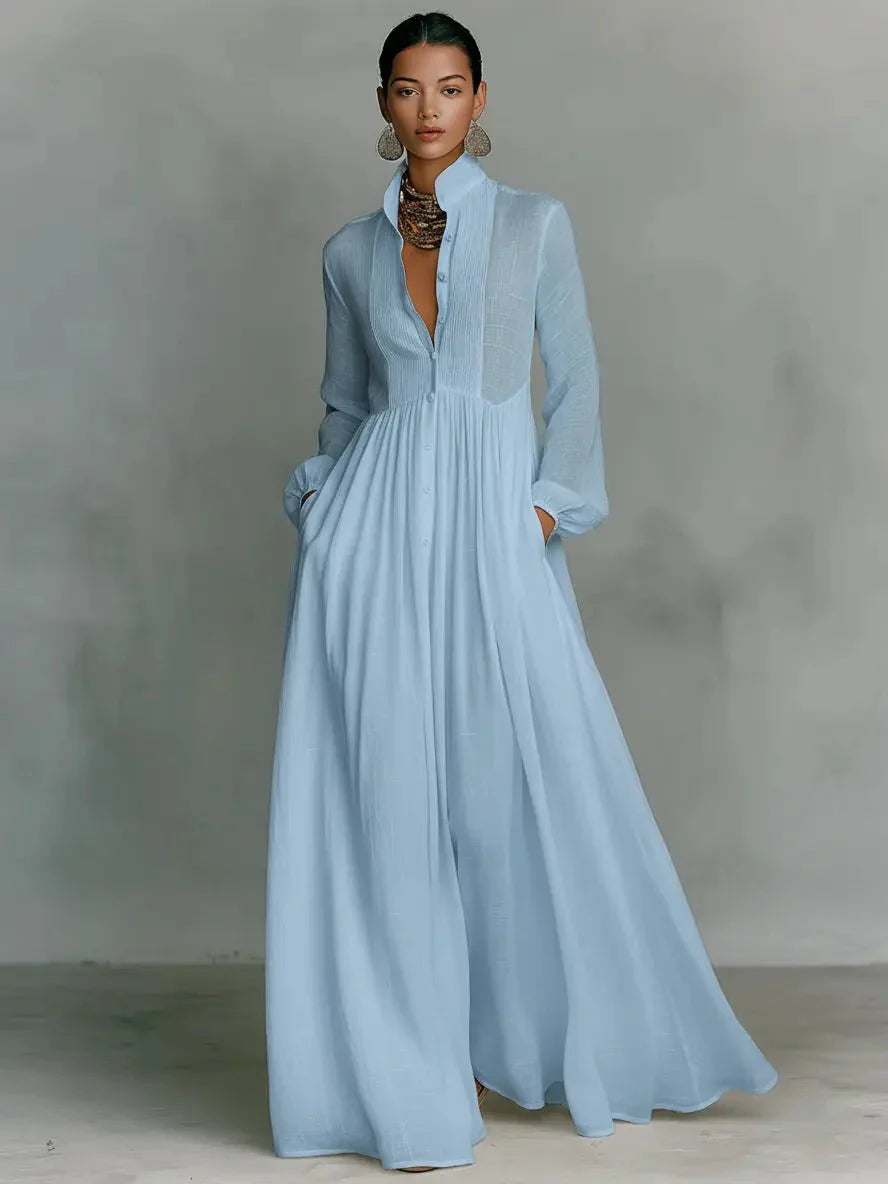 Close-up of stand-up collar and button-through front detail on white maxi dress