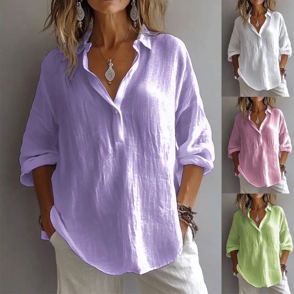 Close-up view of white linen shirt showing woven texture, button-through front, and relaxed three-quarter sleeve detail