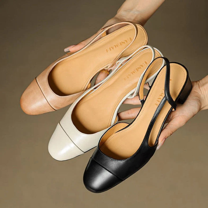 Women's slingback pumps worn with midi dress showing open-back design and stable heel