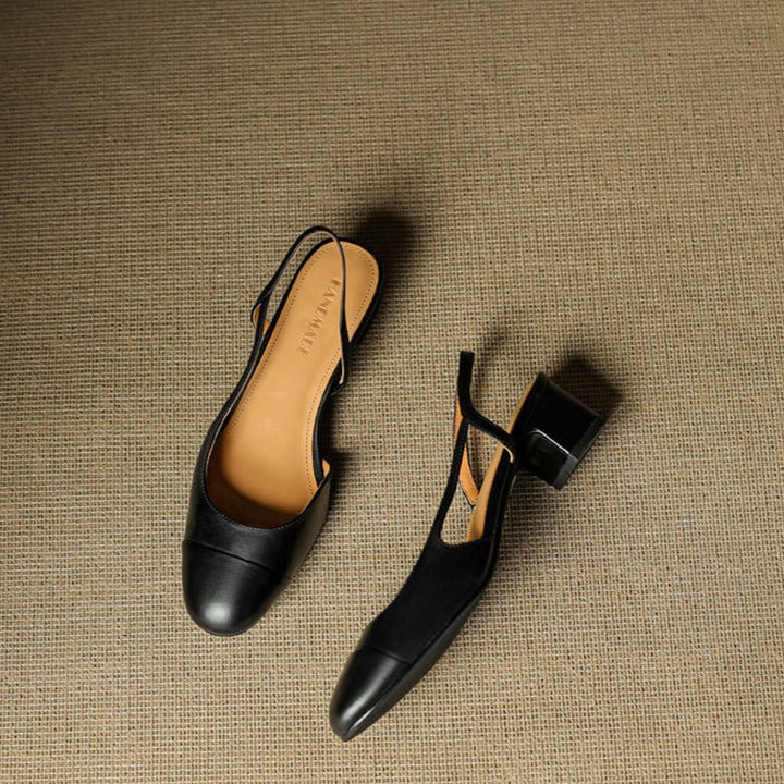 Women's pumps styled with tailored trousers showing almond toe and adjustable slingback strap