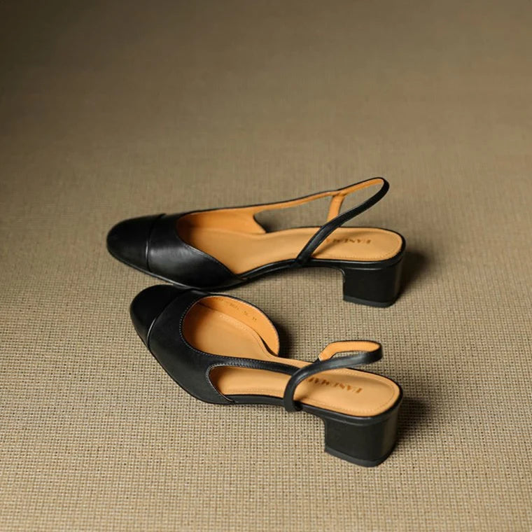 Detail of women's slingback pumps leather upper and open-back design with secure strap