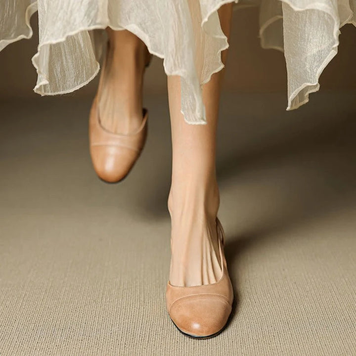 Side view of women's block heel pumps with slingback strap and sturdy heel construction