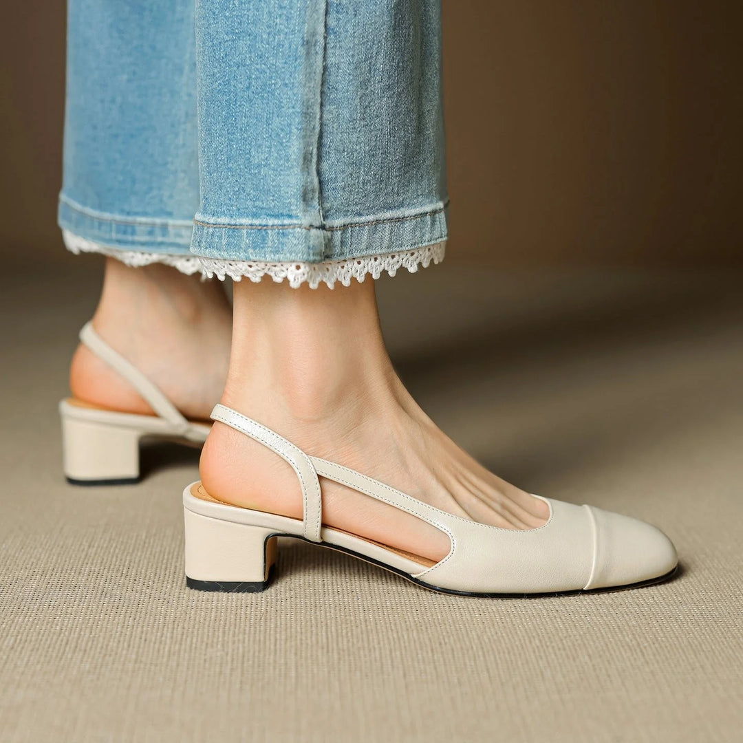 Close-up of women's pumps slingback strap and structured leather finish with stitching detail