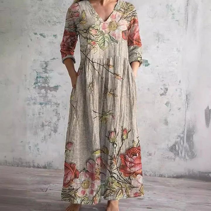 Floral print maxi dress with V-neckline and three-quarter sleeves in botanical pattern on neutral base