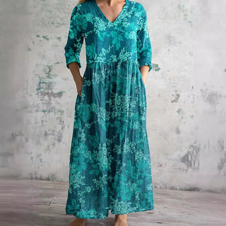 Floral print maxi dress styled for casual wear showing ankle-length hem and relaxed silhouette