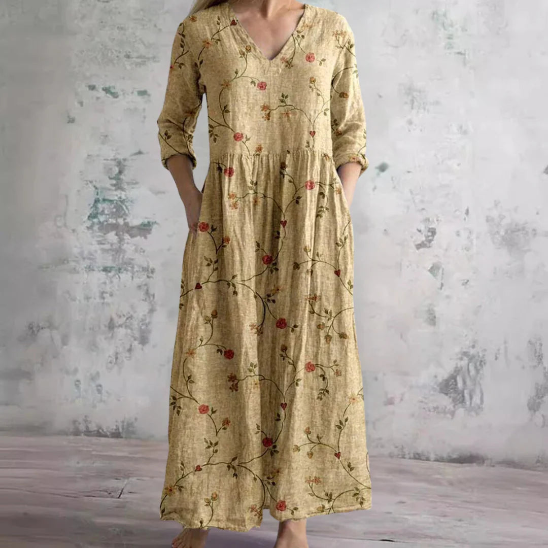 Back view of floral print maxi dress showing full-length silhouette and botanical pattern placement