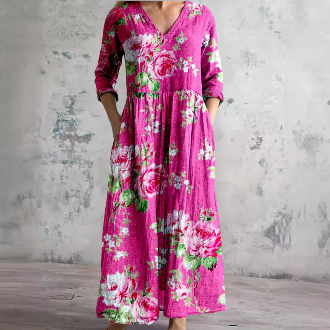 Floral print maxi dress paired with casual footwear showing relaxed fit and side pockets
