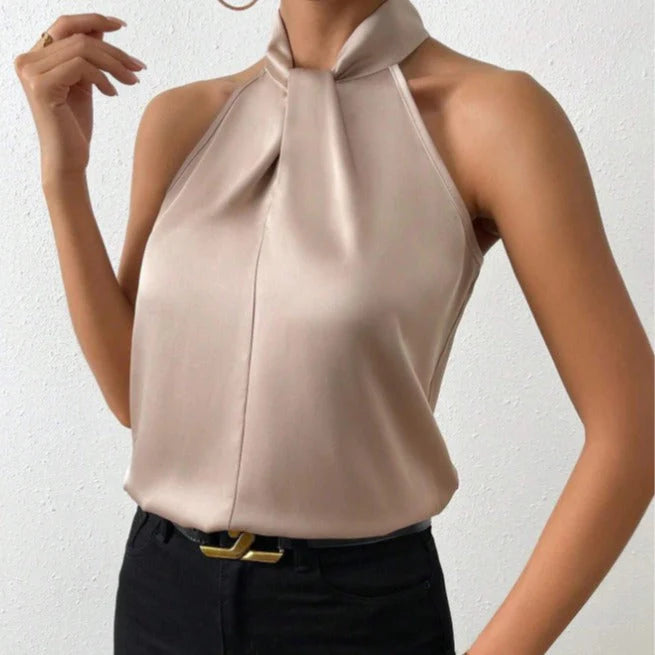 Women's halter neck satin blouse in champagne with twisted neckline detail and sleeveless design