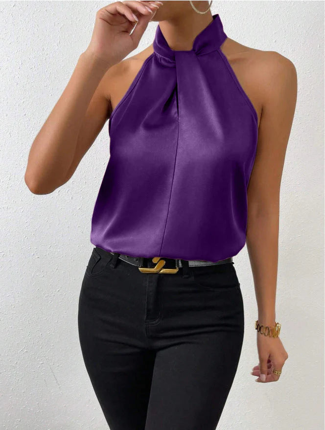 Women's satin halter top in champagne displaying smooth finish and elegant draping