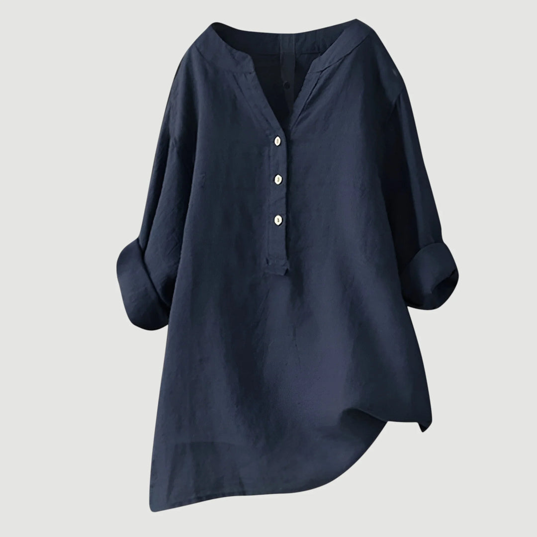 Detail of three-button placket and v-neckline on women's relaxed linen shirt