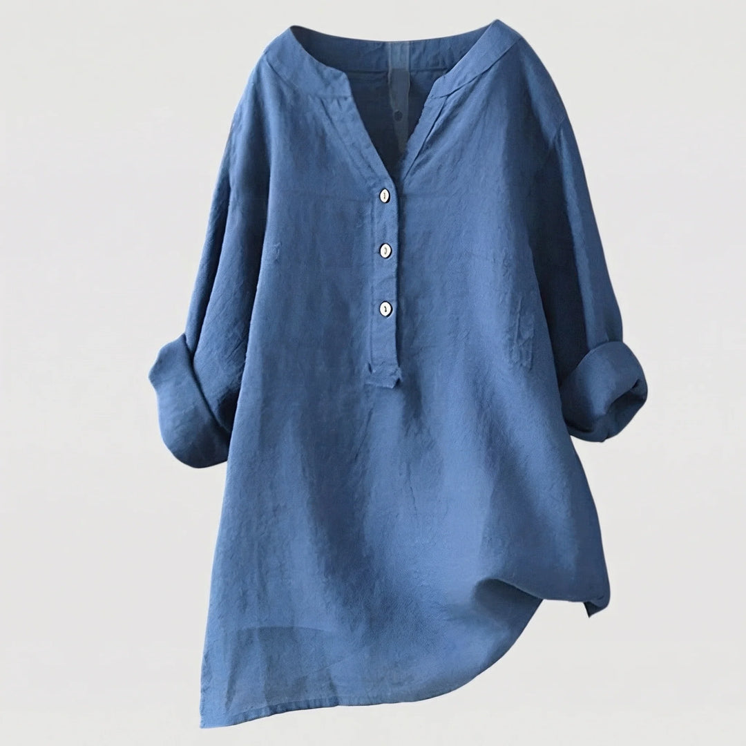 Women's v-neck linen shirt in coral showing airy woven texture and casual silhouette