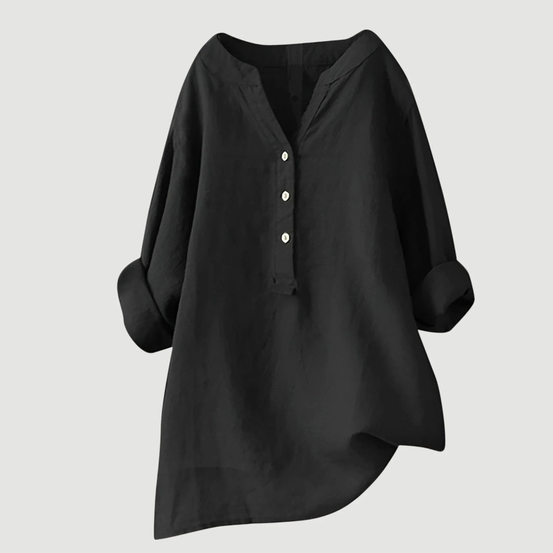 Close-up of roll-tab sleeve detail on women's v-neck linen shirt