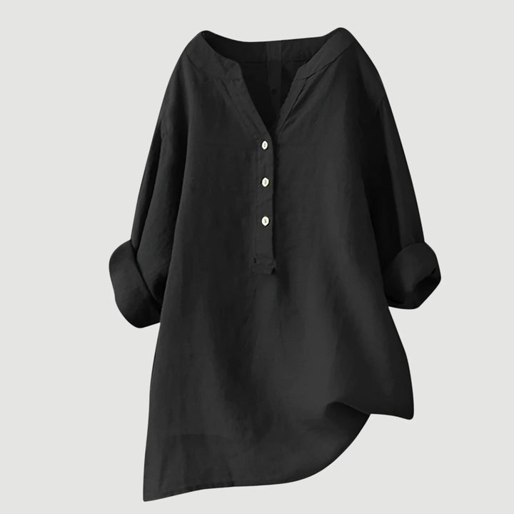 Close-up of roll-tab sleeve detail on women's v-neck linen shirt