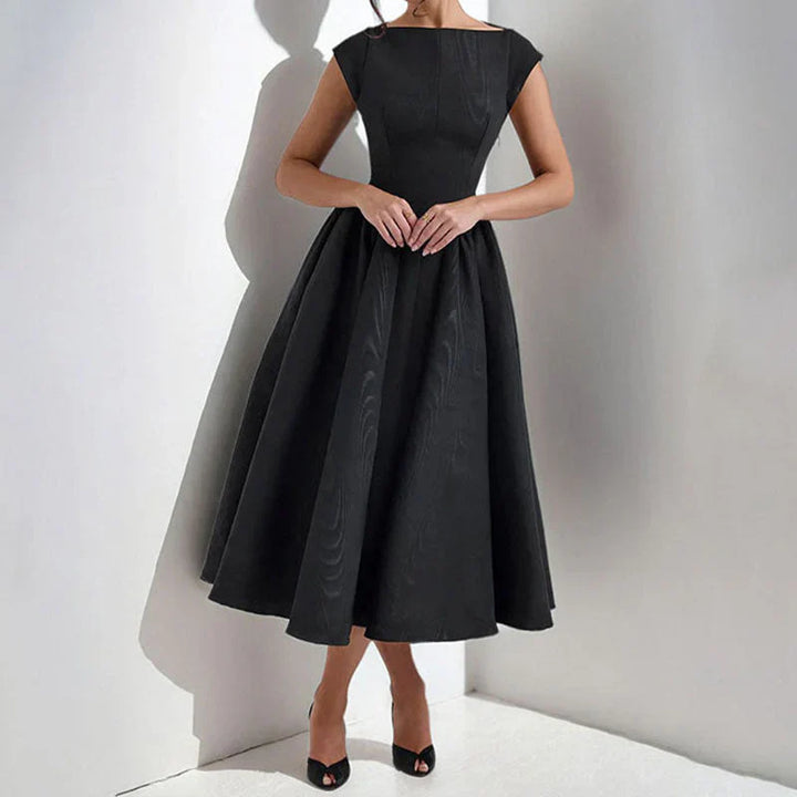 Close-up view of cap sleeve fit and flare midi dress showing structured bodice and flowing skirt detail
