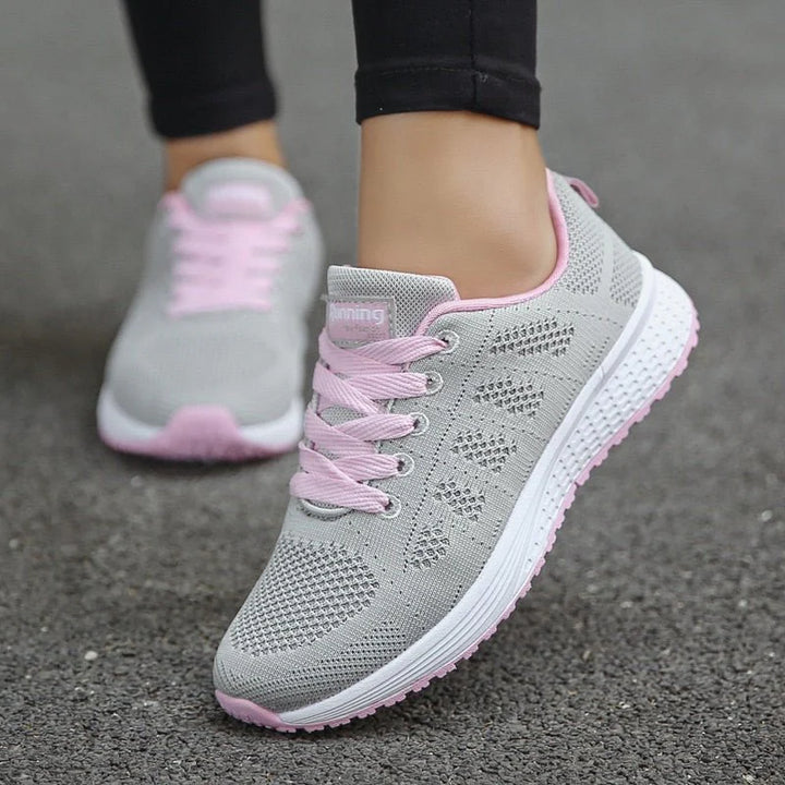 Close-up of textured outsole on women's mesh trainers for reliable traction
