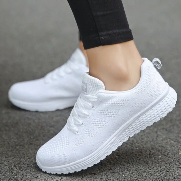 Close-up of women's mesh trainers highlighting soft knit construction and cushioned insole