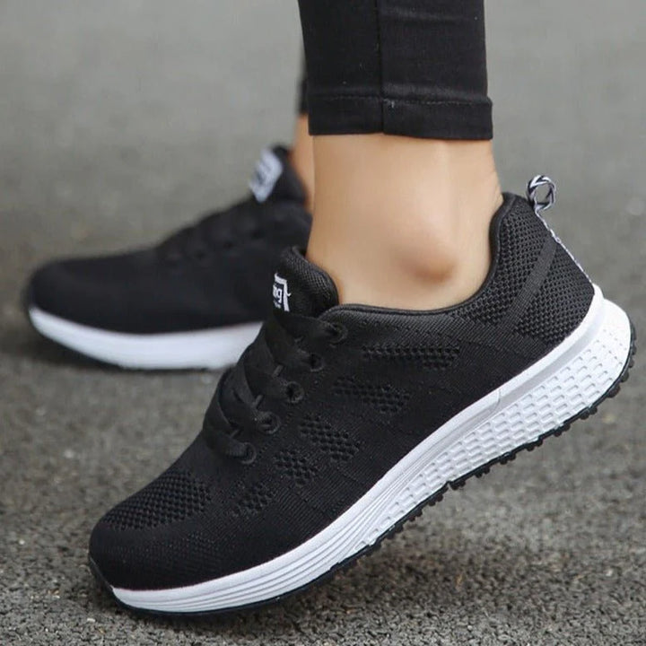 Rear view of women's lace-up trainers showing padded heel collar and structured sole