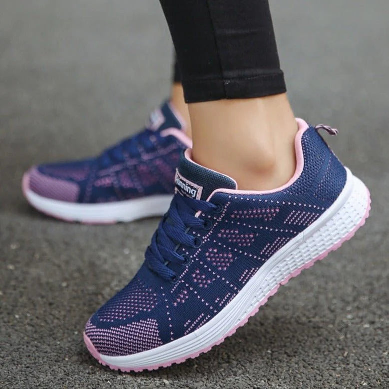 Women's white trainers with arch support insole and secure lace-up fastening