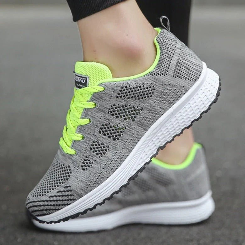 Detail of women's mesh trainers featuring cushioned midsole and flexible construction