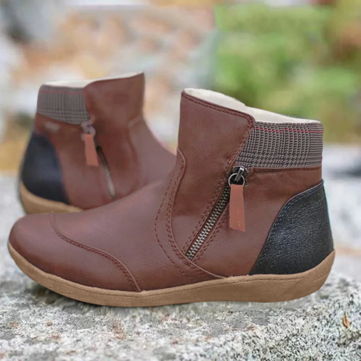 Side profile of women's waterproof ankle boots with cushioned footbed and slip-resistant sole